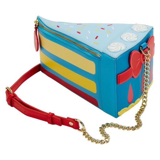Blue, yellow, and red crossbody bag in the shape of a slice of cake, in the style of Snow White's iconic dress.